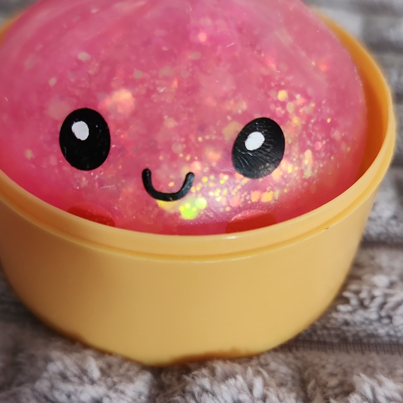Pink Glitter Gel Squeeze Ball Stress Reliever in Yellow Plastic Cup, 3 in
